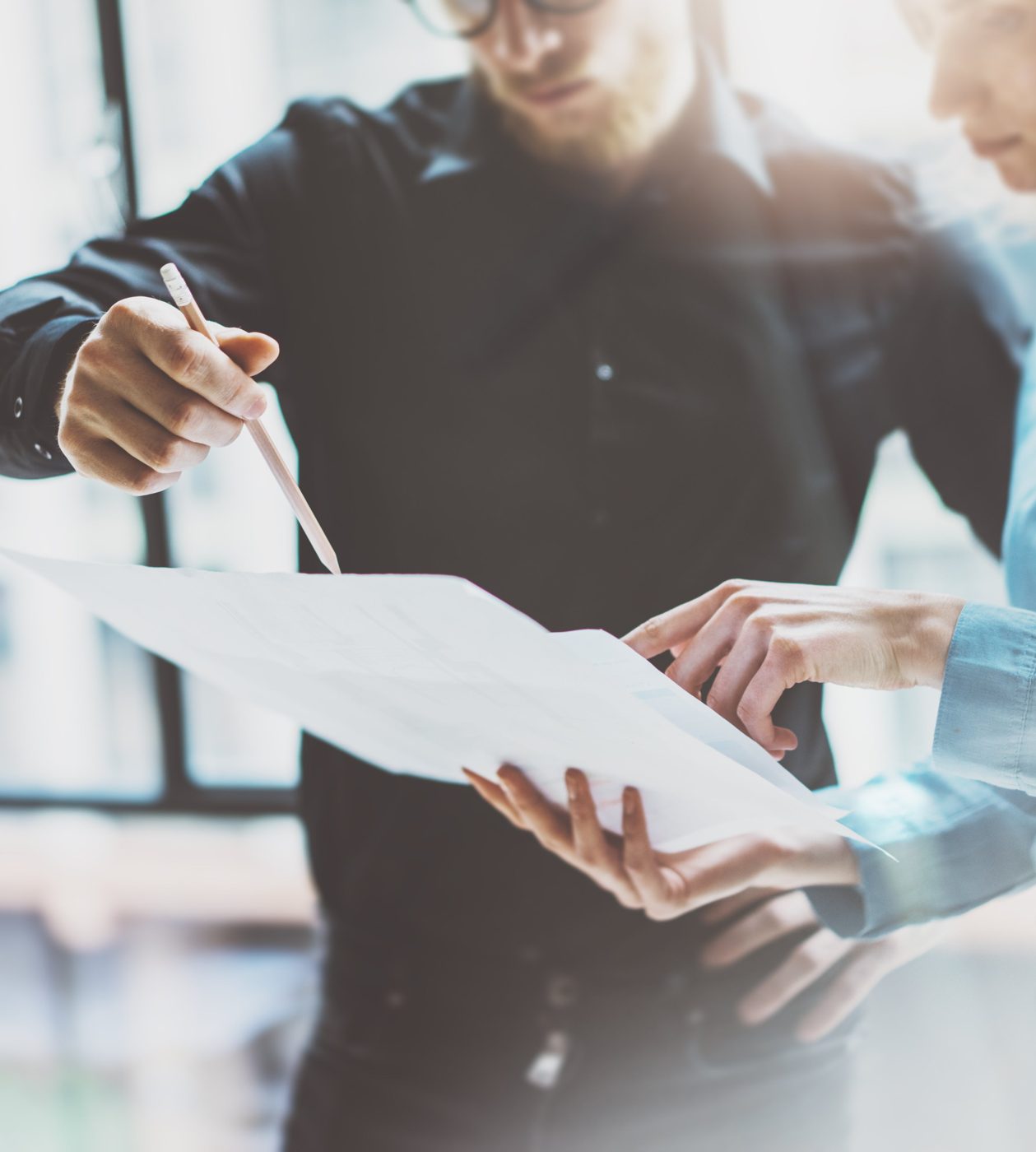 Two people reviewing paperwork together