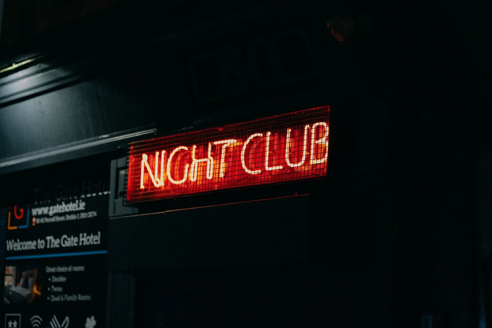 A neon nightclub sign at night